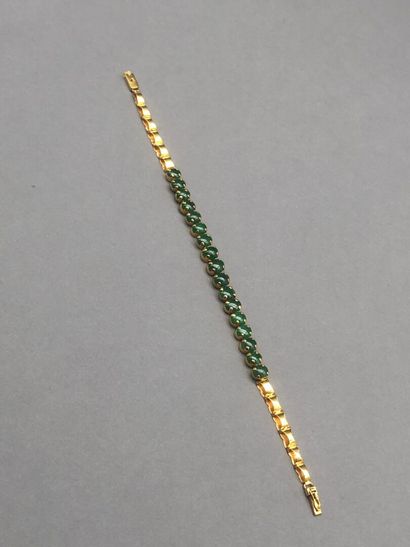 null Bracelet in 14K yellow gold (585 °/°°) centered with oval jade jadeite cabochons....
