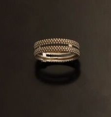 null MAUBOUSSIN

Ring in 18K (750°/°°) white gold with two openwork rings and pavement...