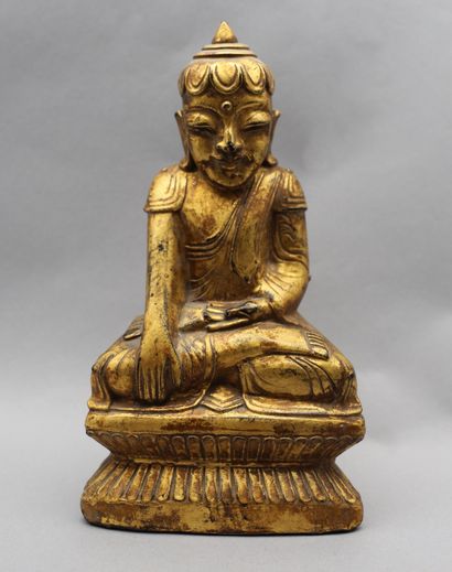 null Gilded wood sculpture depicting Buddha seated in meditation in the position...