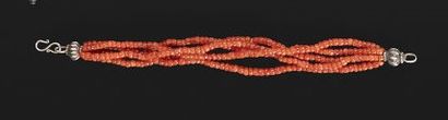 null 
Lot including: 




- A bracelet of coral beads.




Length: 20 cm




- A...