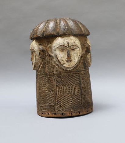 null Ngontang helmet mask made of wood with a dark patina and shells (cowries). Decorated...