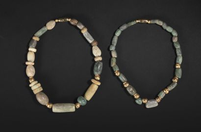 null Two necklaces made of hard stone beads, probably ancient jade and modern brass...