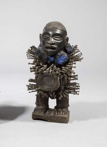 null Nkisi nail fetish statue in wood and glass and various materials. 

Kongo, Democratic...