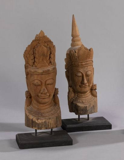 null Lot of two wooden sculptures featuring Buddha heads with serene faces and half-closed...