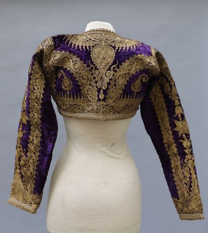 null Short jacket in purple velvet amply embroidered in thread and gold and silver...