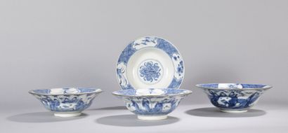 null 
Set of four circular porcelain bowls with silver rim. Decorated in blue and...