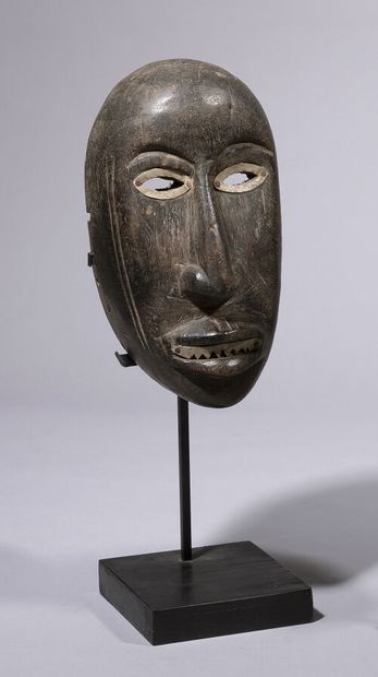 null Mask in wood with black patina and metal (aluminum) around the mouth and eyes....