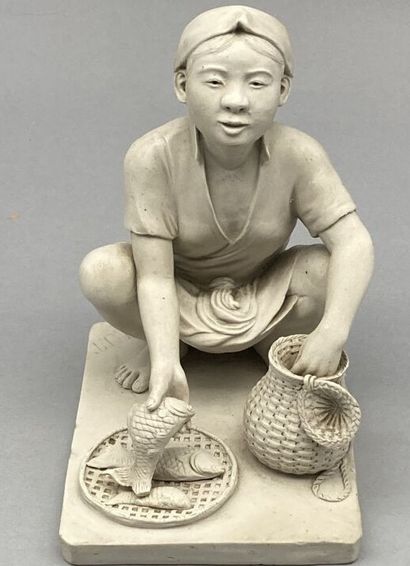 null Porcelain stoneware subject representing a seated fish merchant. Marked "H.U.T."...