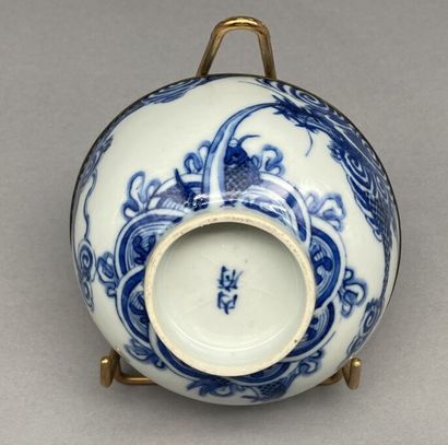null Lot including:

- A blue and white porcelain bowl known as "Hue blue" with metal...
