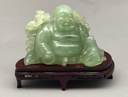 Green hardstone subject carved with Buddha....