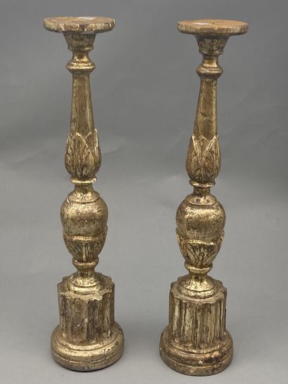 null Pair of molded, carved, stuccoed and gilded wood pikes. Shaft with knot decorated...