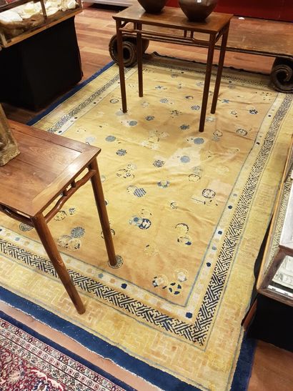 null 
Large carpet with cream background decorated with blue motifs, blue border...