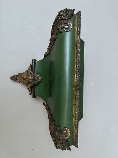 null Wall lamp and its wall console in wood painted in green. The cartel with bronze...