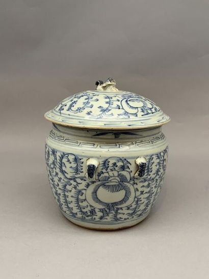 null Covered pot with a flared body in porcelain. Blue and white cameo decoration...