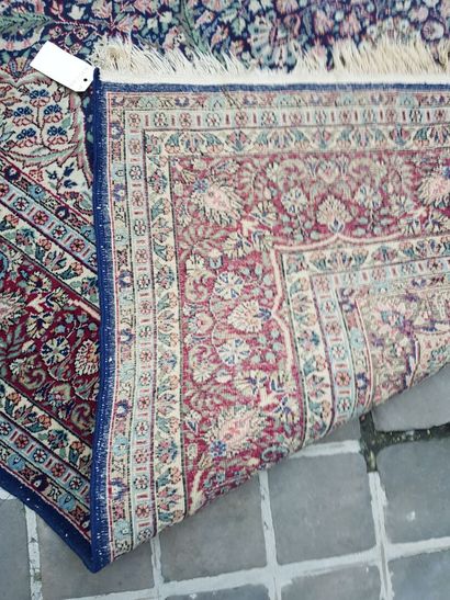 null Lot including:

- A large rectangular carpet with bangs decorated with stylized...