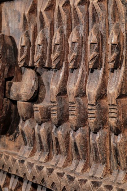 null Wooden door of a hut carved with Nommo and decorated with a lock. 

Mali, Dogon....