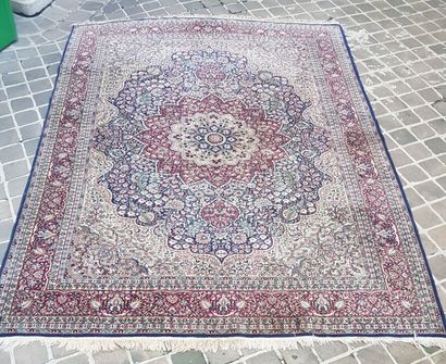 null Lot including:

- A large rectangular carpet with bangs decorated with stylized...