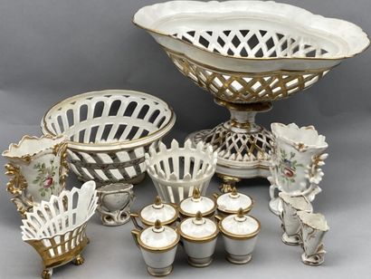 null Lot of shaped pieces in porcelain of Paris with golden highlights on white background...