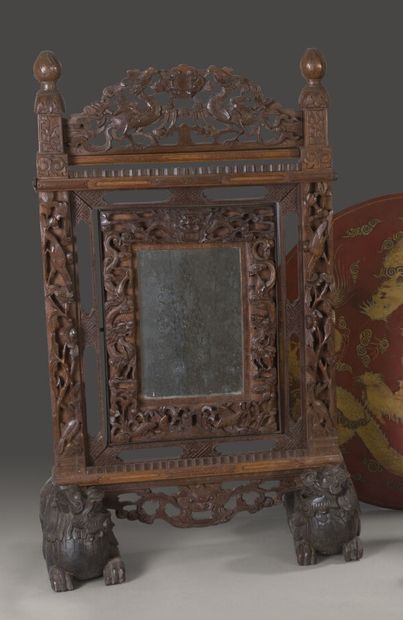 Psyche mirror in exotic wood richly carved...