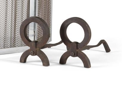 Pair of wrought iron andirons. Decorated...