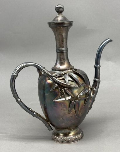 null Teapot with long neck in silver 800°/°°, the body decorated with bamboos, the...