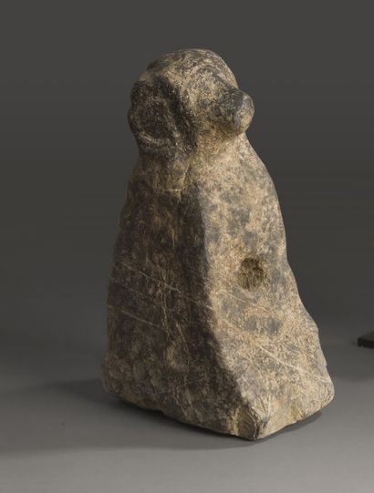 null Statue of a guardian of the home in stone featuring a seated dog. Traditionally...