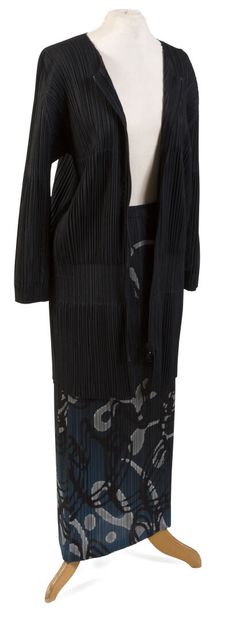 null ISSAYÉ MIYAKÉ.
Pleats Please.
Outfit featuring a zippered jacket and a black...