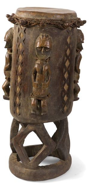 Wooden drum with carved decoration of 4 figures,...