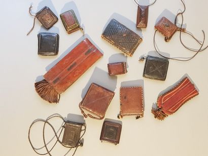 Set of 14 West African leather cases. 
Various...