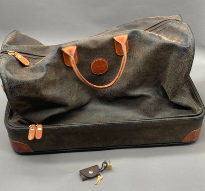 Brown leather travel bag with two handles....