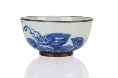 null Hué blue-white porcelain bowl decorated with a carp followed by a dragon emerging...