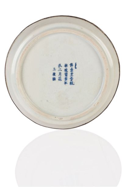 null A Hué blue-white porcelain dish decorated with a lacustrine landscape animated...