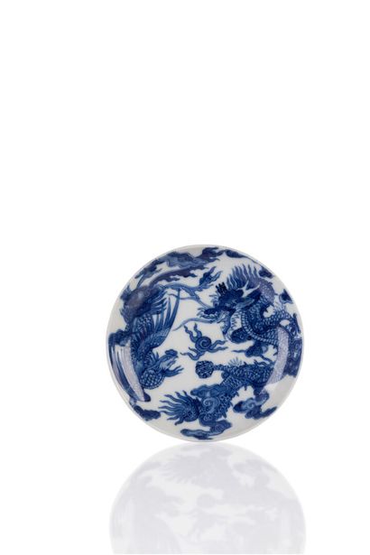 null Blue-white porcelain dish called Bleu de Hué decorated with a dragon and a phoenix...