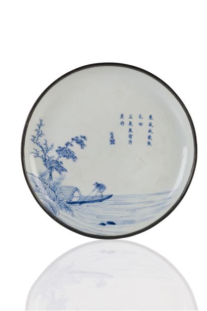 null Porcelain dish with a blue-white "Hué blue" decoration of a boatman and his...