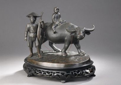 null BRONZE A PATINE BRUNE SUR SOCLE REPRESENTANT UN JEUNE GARDIEN DE BUFFLE ET UN...