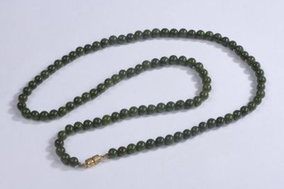null Long necklace of nephrite jade beads. Clasp in gold plated metal tube. Slight...