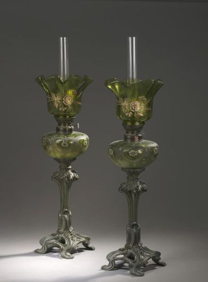 null Pair of Art Nouveau oil lamps
Legs in patinated ruler, tanks and glass in enamelled...