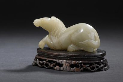 null Celadon jade horse
China
Shown lying down, wooden base
L. 9 cm
