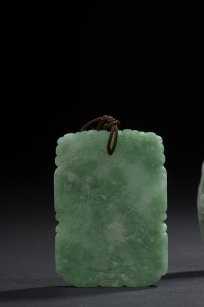 null Jadeite pendant
China, 20th century
Rectangular, one side decorated with immortals,...