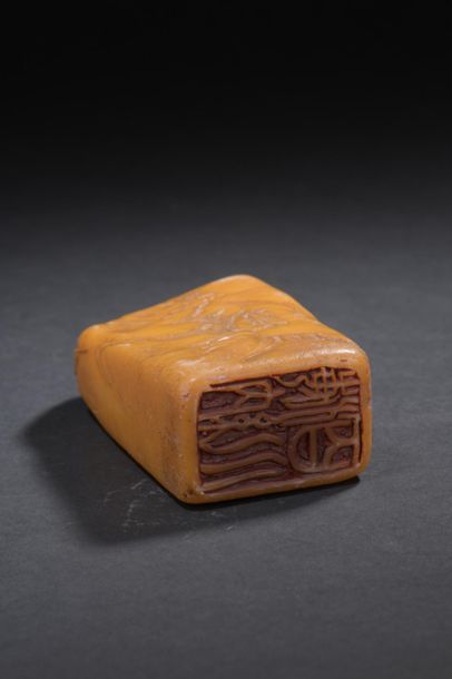 null Orange-yellow soapstone stamp
China
One side decorated in light relief with...