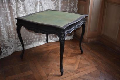 null Napoleon III
period blackened moulded and carved wood game table resting on...