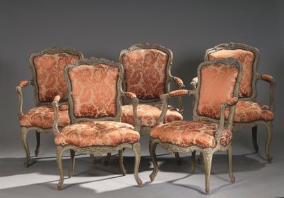 null A suite of five convertible armchairs, Louis XV
period work from Lyon. Decorated...