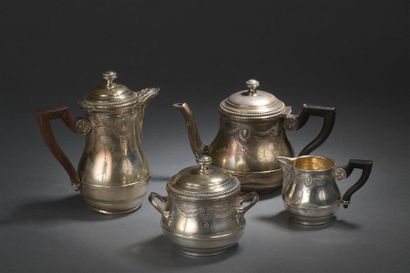 null Coffee and tea set in silver, Minerva
hallmark decorated with friezes of pearls...