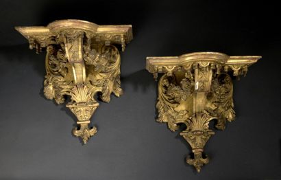 null Pair of Louis XIV style gilded stucco and wood sconces, circa 1850
. Decorated...