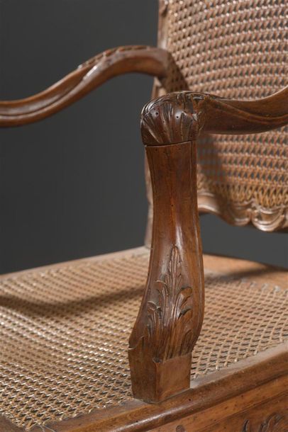 null Moulded wood armchair carved and caned by Jean Baptiste Cresson, Louis XV
period....