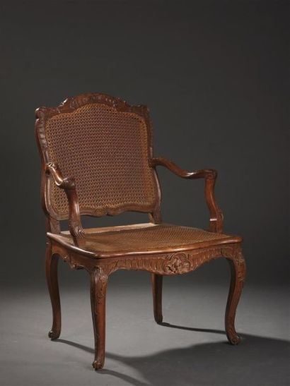 null Moulded wood armchair carved and caned by Jean Baptiste Cresson, Louis XV
period....