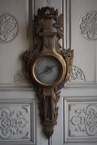 null Barometer in gilded wood from the end of the Louis XVI period 
Decorated with...