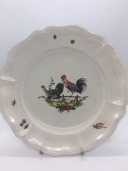 null SAINT CLÉMENT, 18th century
Earthenware plate decorated with roosters in the...