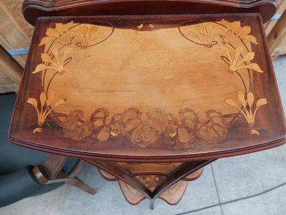 null FRENCH WORK, 1900
Moulded walnut saddle with triple trays 
With flower marquetry...