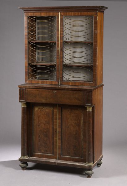null A mahogany and mahogany veneer double bookcase with detached columns, England,...